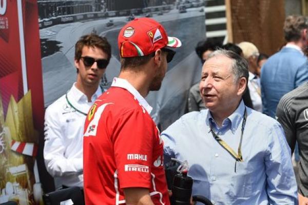 Presiden FIA, Jean Todt berbicara dengan Sebastian Vettel (ist)