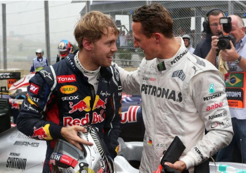 Sebastian Vettel muda bersama sang hero Michael Schumacher di grid F1. (Foto: planetf1)
