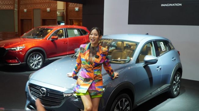 Mazda goda pengunjugn pameran otomotif GJAW dengan inovasi produk dan fashion yang memukau